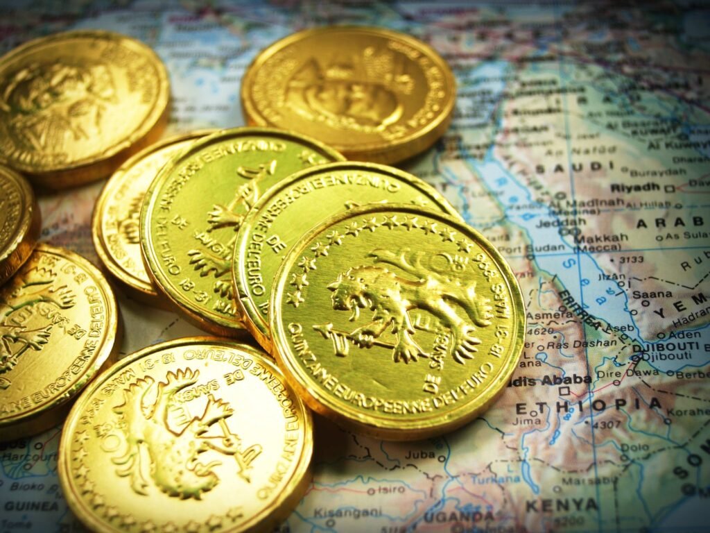 Gold coins sitting on a map