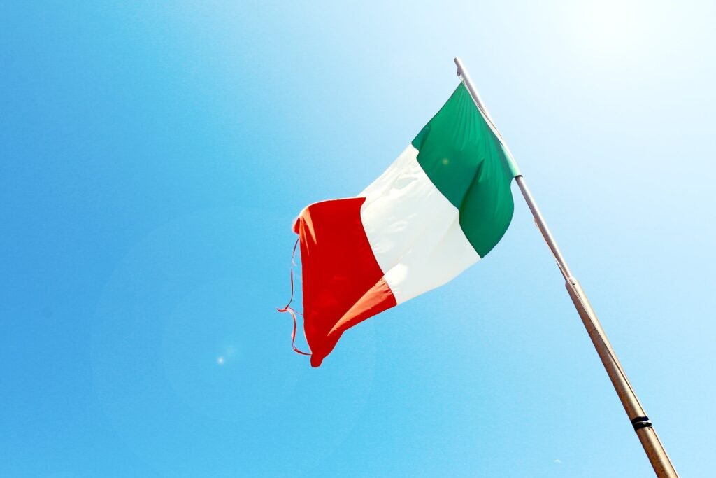 The flag of Italy with the sky in the background