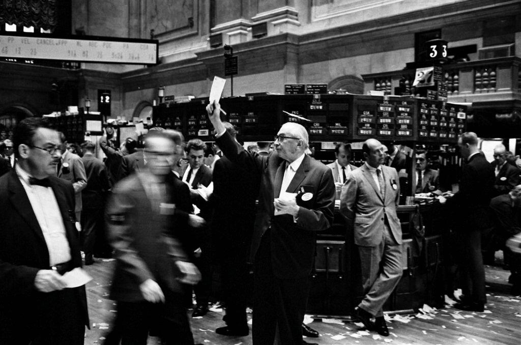Old time image of brokers on the NYSE trading floor