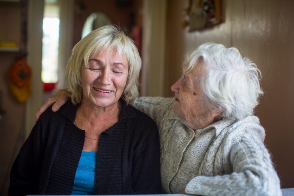 An elderly woman with her adult daughter.